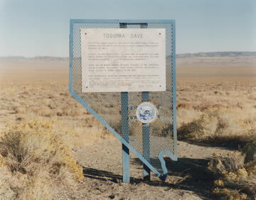 Blue, Nevada-shaped historical marker at Toquima Cave in Lander County