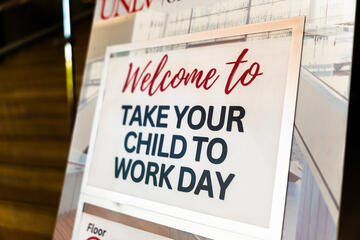 Hospitality College sign that says "Welcome to take your child to work day"
