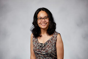 Joanne Ullman in blouse and glasses